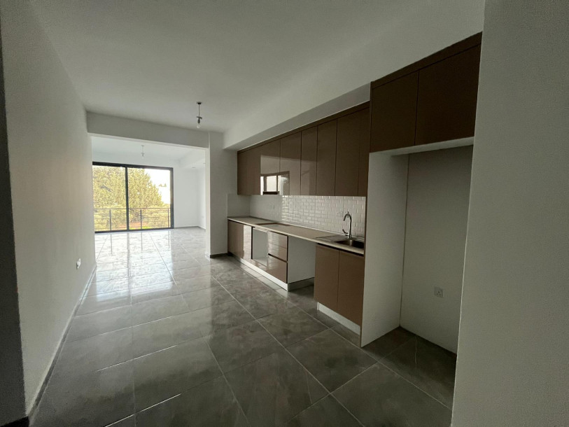 GİRNE/ÇATALKÖY'DE ANA CADDE ÜZERİ SATILIK 1+1/2+1 SIFIR DAİRELER-3