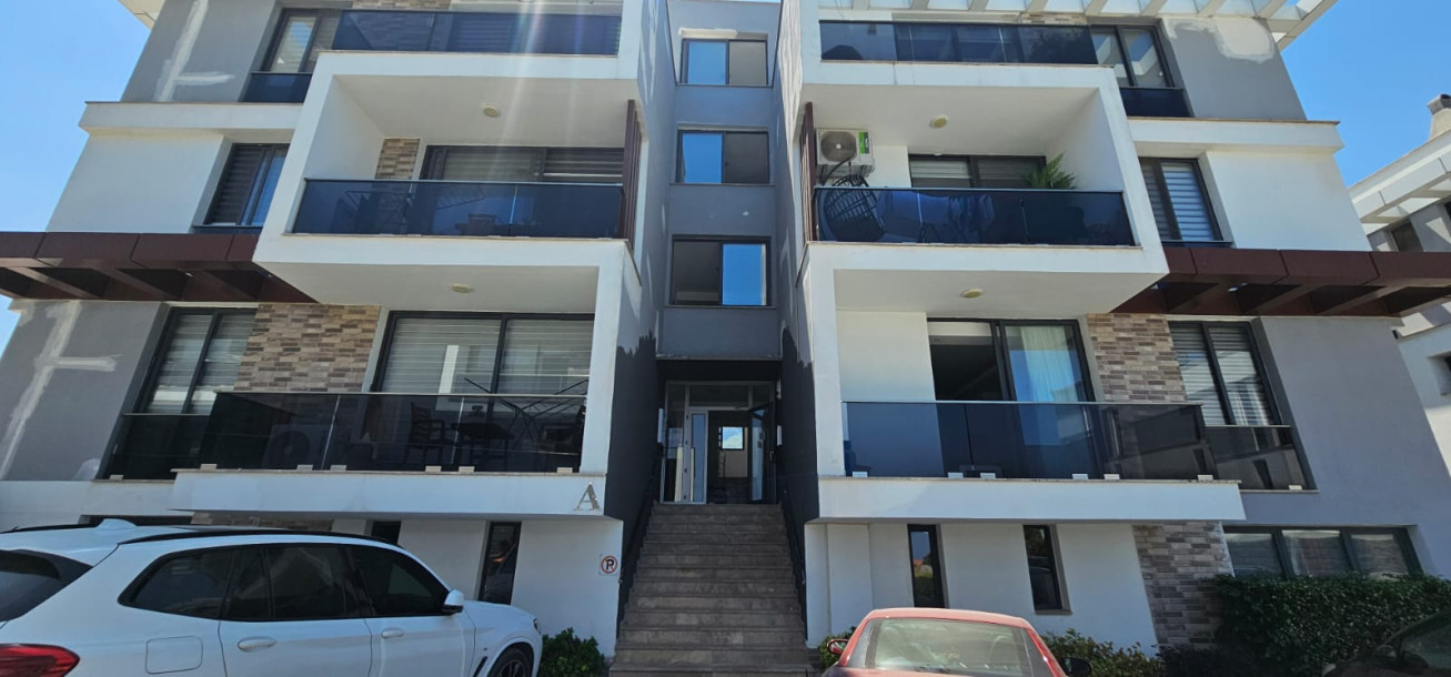 GİRNE/LAPTA'DA HAVUZLU SİTE İÇERİSİNDE SATILIK 2+1 BAHÇELİ DAİRE-1
